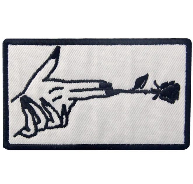 Patch brodé en forme de Finger Gun et fleur